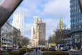 View through a bow of a modern artwork over the Berlin boulevard `Tauentzien` with shops to historic `Kaiser-Wilhelm-Memorial-Chur