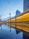 Berlin, Germany - March 21, 2021 - View of the famous Alexanderplatz with a moving tram at dusk