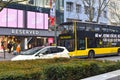 View over the Berlin boulevard `Tauentzien` with shops, bus and taxi