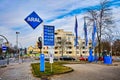 Price board of an Aral Group gas station with extremely high prices and a blurred taxi in the foreground Royalty Free Stock Photo