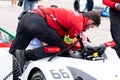 Audi staff member checking a race car