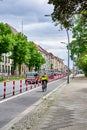 Cyclist in a dedicated cycle lane on a main road