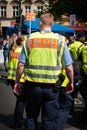 German police from behind in crowded street parade on labor day in Berlin