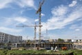 BERLIN, GERMANY, MAY 24, 2018: Many operating cranes at building site in Berlin, beside a canal. Royalty Free Stock Photo
