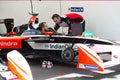 Mechanic checking a racing car