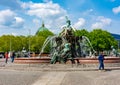 Neptune fountain Neptunbrunnen on Alexanderplatz with Berlin cathedral dome at background Royalty Free Stock Photo