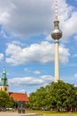 The Nikolaikirche (St. Nicholas\' Church) with the famous Television Tower in Berlin, Germany