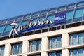 Radisson Blu hotels and resorts logo on the building of hotel Royalty Free Stock Photo