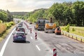 Traffic jam was formed because of the closed road during repair works on asphalt laying by road