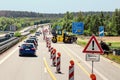 Traffic jam was formed because of the closed road during repair works on asphalt laying by road