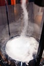 Woman making a tornado of smoke in German Technical museum