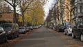 Tilt up from German sign Bicycle Street Fahrradstrasse to Cyclist riding along Bergmanstrasse in Kreuzberg on a sunny