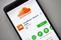 Berlin, Germany - November 19, 2017: Soundcloud application on screen modern smartphone in Play Store. Sound cloud app