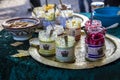 Colorful jars of jam on a metal tray in Flohmarkt im Mauerpark market in Berlin,