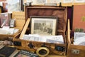 BERLIN, GERMANY - OCTOBER 14, 2017: Open air shop on the street, old antique box and photos, books and old postcards. Flea market