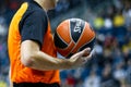 A referee holds the official basket game ball Royalty Free Stock Photo