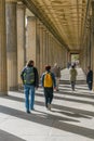 BERLIN, GERMANY - SEPTEMBER 26, 2018: Colorful perspective of people walking under an ancient greek construction that