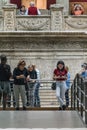 BERLIN, GERMANY - SEPTEMBER 26, 2018: Horizontal view of visitors playing with the audio guide near the Architecture of