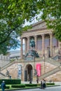 BERLIN, GERMANY - September 26, 2018: View framed by trees of the front garden, entrance stairs and facade of the Alte