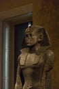 BERLIN, GERMANY - SEPTEMBER 26, 2018: Zoomed in dark and profile picture of the Praying statue of the pharaoh king