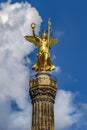Berlin Germany. Victory column photographed from a low point of view. The background a cloudy blue soft sky Royalty Free Stock Photo