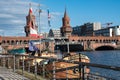 Berlin Oberbaum Bridge and a boat in foreground