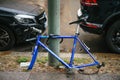 Berlin, October 2, 2017: Blue bicycle attached to street pillar with lock stands without wheels after being stolen in Royalty Free Stock Photo