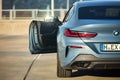 Berlin - October 2021: BMW 8 Series G16 Gran Coupe 840i xDrive M-pack 2021. Back view selective focus with opened door out of