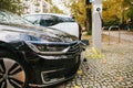 Berlin, October 2, 2017: Electric cars are being charged at a special place for charging electric vehicles. A modern and Royalty Free Stock Photo