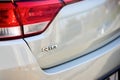 Berlin - October 2021: grey metallic sedan car 2017 Kia Rio IV Sedan YB fourth generation back side chrome emblem sign