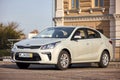 Berlin - October 2021: grey metallic sedan car 2017 Kia Rio IV Sedan YB fourth generation left side view at city parking