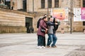 Berlin, October 1, 2017: A group of unknown Asian tourists do selfie next to the sights on a smart phone