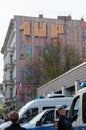 Police in front of spray-painted facade. The graffiti crew 1UP and the lettering artist Paradox