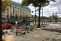 Many Electric E-Scooters of different Ride Sharing Companies parked chaotically on a sidewalk in Berlin close to the Brandenburg