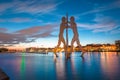 Berlin skyline with Molecule Man sculpture in Spree river at sunset, Germany