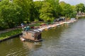 Berlin-Treptow, Germany - May 21, 2022, Floating wooden house. View of the Spree with restaurants and several boat