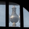 The Berlin TV tower behind an old window Royalty Free Stock Photo