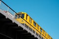 The Berlin U-Bahn train metro train U1 on elevated railroad bridge outdoor Royalty Free Stock Photo