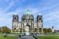 The Berliner Dom, or Cathedral of Berlin, in Germany. Summertime view of the cathedral with visitors in foreground Copper green