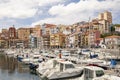 Bermeo, Basque Country, Spain - July 16, 2020: fishing port with colorful facades of houses and fishing boats against the backdrop