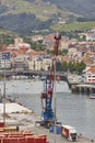 Bermeo commercial harbor and pier with crane. Basque country