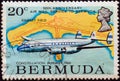 BERMUDA - CIRCA 1975: A stamp printed in Bermuda shows Lockheed Constellation of 1946 and Kindley field airport map, circa 1975. Royalty Free Stock Photo