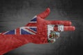 Bermuda flag painted on male hand like a gun