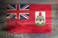 Bermuda flag on rustic old wood surface background
