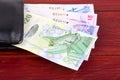 Bermudian Dollars in the black wallet