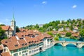 Bern, the capital of Switzerland, with dominant Nydegg Church and historical center located along turquoise Aare River. Bridge