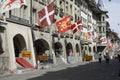 Various flags on the facades of townhouses