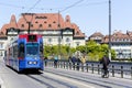 Blue tram drive cross the bridge in Bern