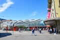 Bern, Switzerland - August 14 2019: People walking in the center of the Swiss capital near the main train station. Red tram in Royalty Free Stock Photo