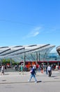 Bern, Switzerland - August 14 2019: People walking in the center of the Swiss capital near the main train station. Red tram in Royalty Free Stock Photo